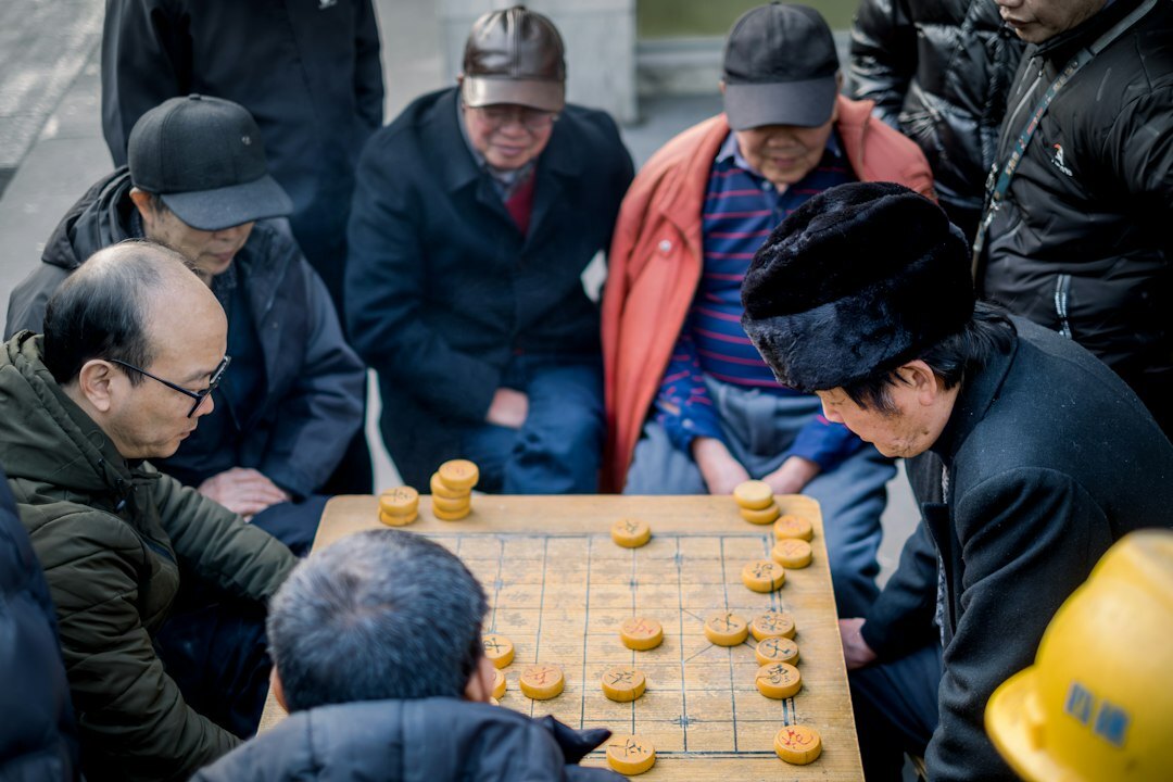 senior men playing board game