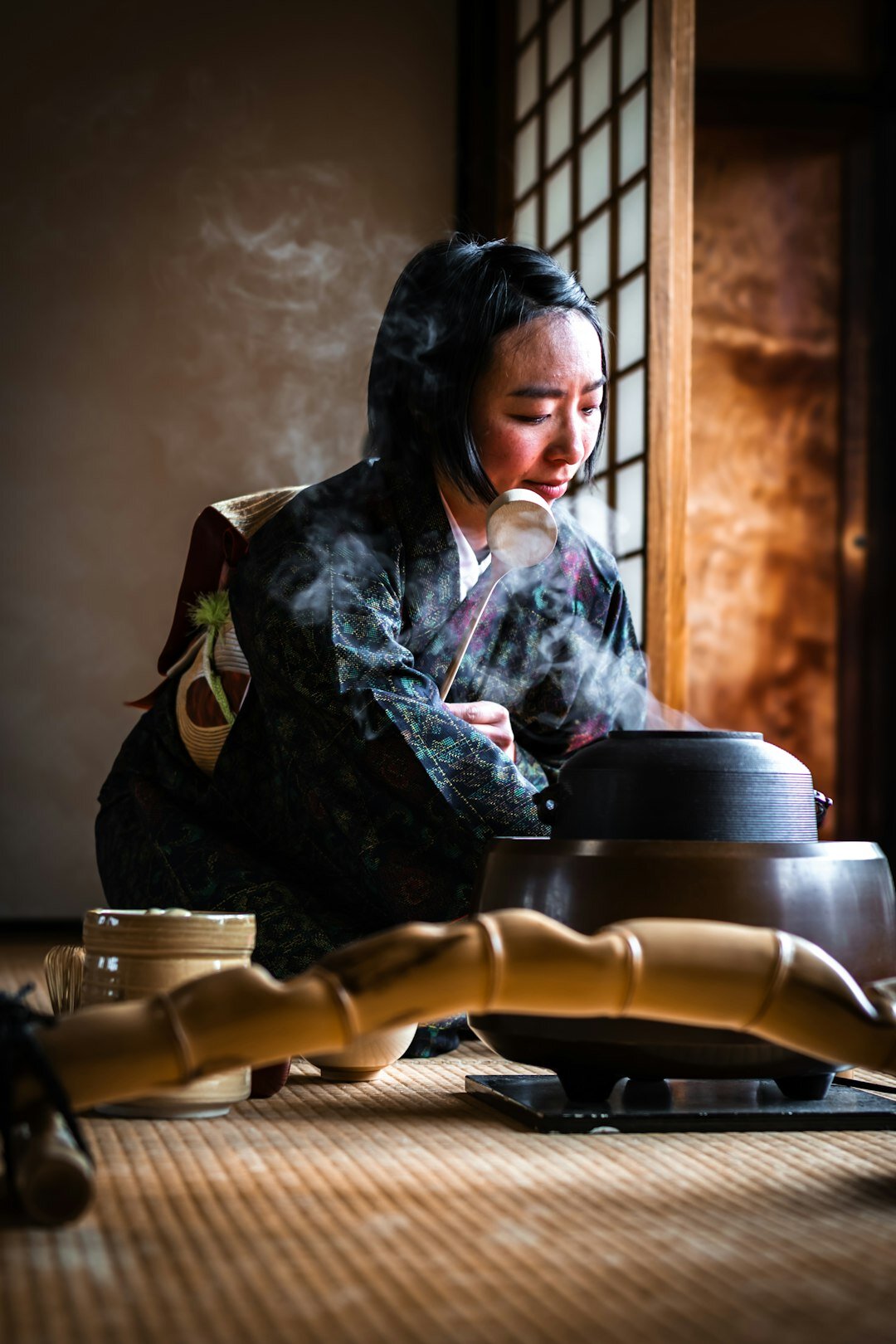 Japanese senior man practicing a traditional tea ceremony